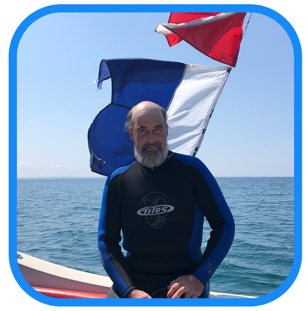 a man sitting in a boat on a body of water