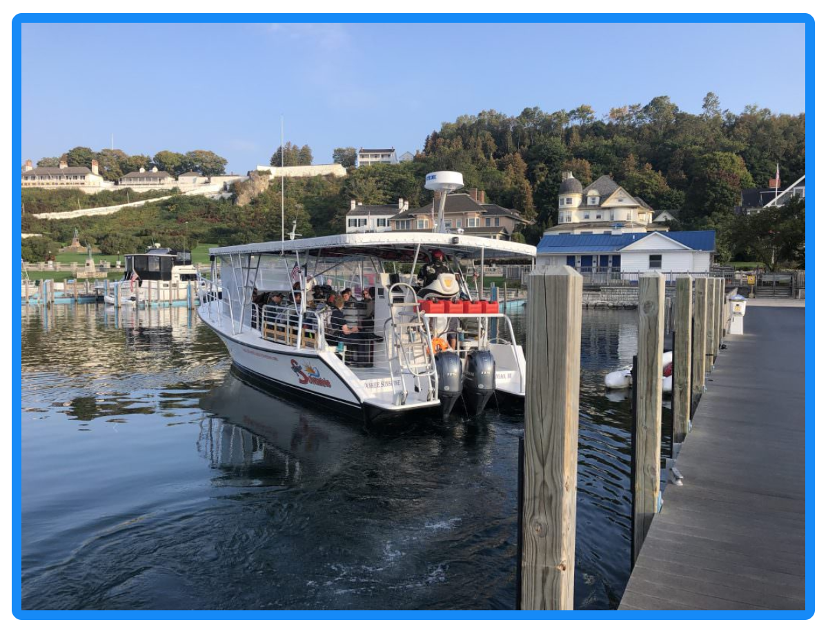 a boat is docked next to a body of water